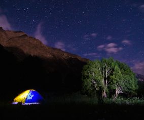 Camping at a river delta in the Pamir Mountains, inside a leaky $20 tent we named 'Oliver'.